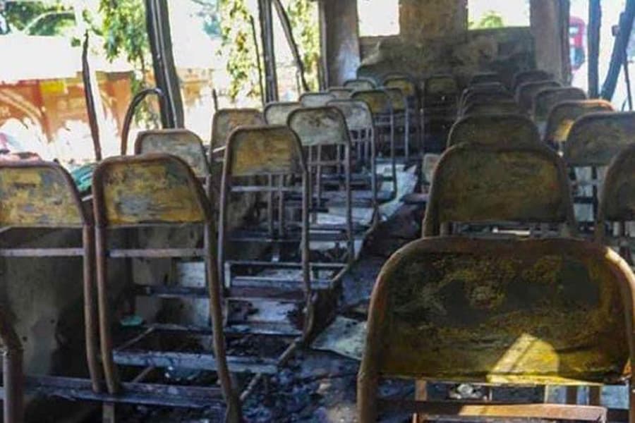 Helper dies after fire breaks out in parked bus