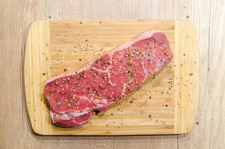Negotiating with the butcher for the perfect steak cut