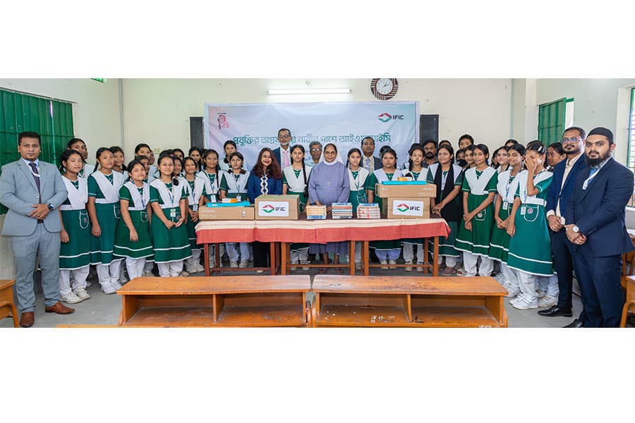 IFIC Bank donates computers and books at Holy Family School