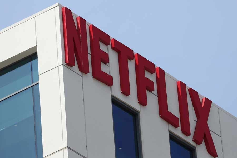 Netflix slightly beats revenue estimates, shares slide