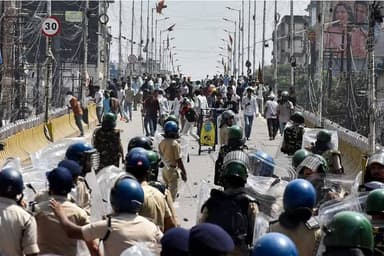 India suspends policeman for firing AK-47 at student protesters