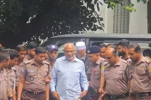 Latif Siddique at tribunal, accompanied by brother Kader Siddique
