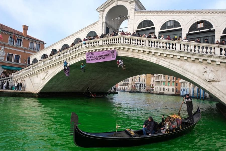 Italian climate change protesters turn Venice’s Grand Canal green