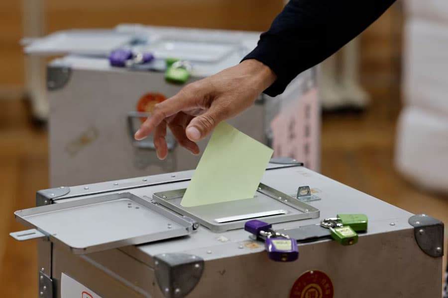 Japan's ruling coalition set to lose parliamentary majority, exit polls show