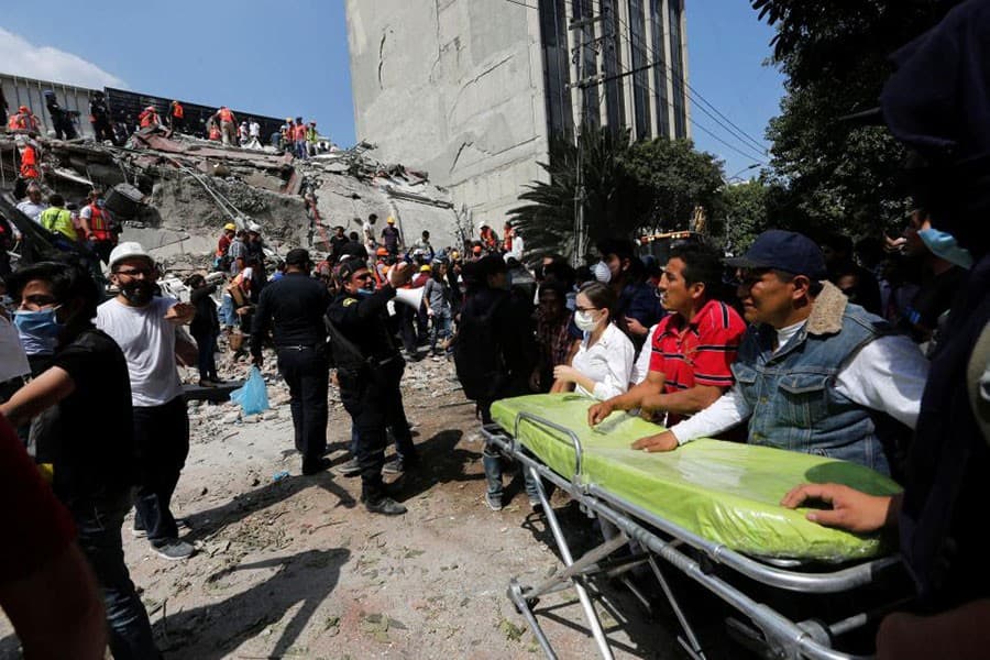 Magnitude 7.1 quake near Mexico City kills at least 216, rescuers dig through collapsed buildings