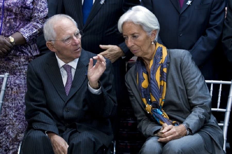 Improving world economy still needs help from low rates, IMF says