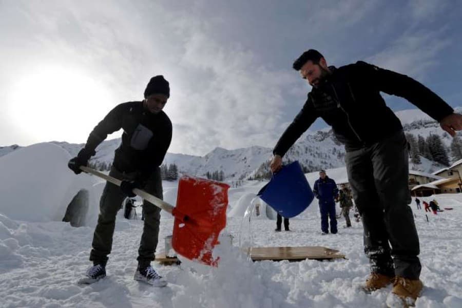 Igloos warm tourists’ hearts as migrants fill hotel
