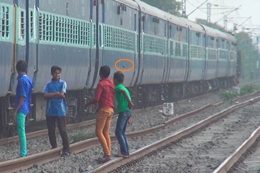 Preventing throwing of stones at running trains   
