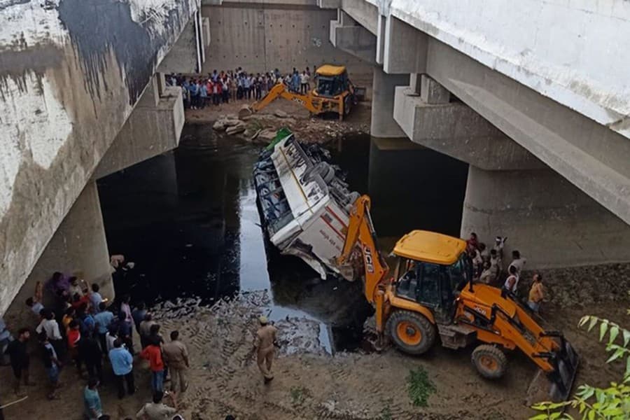 At least 27 people dead as bus falls into drain near Agra city