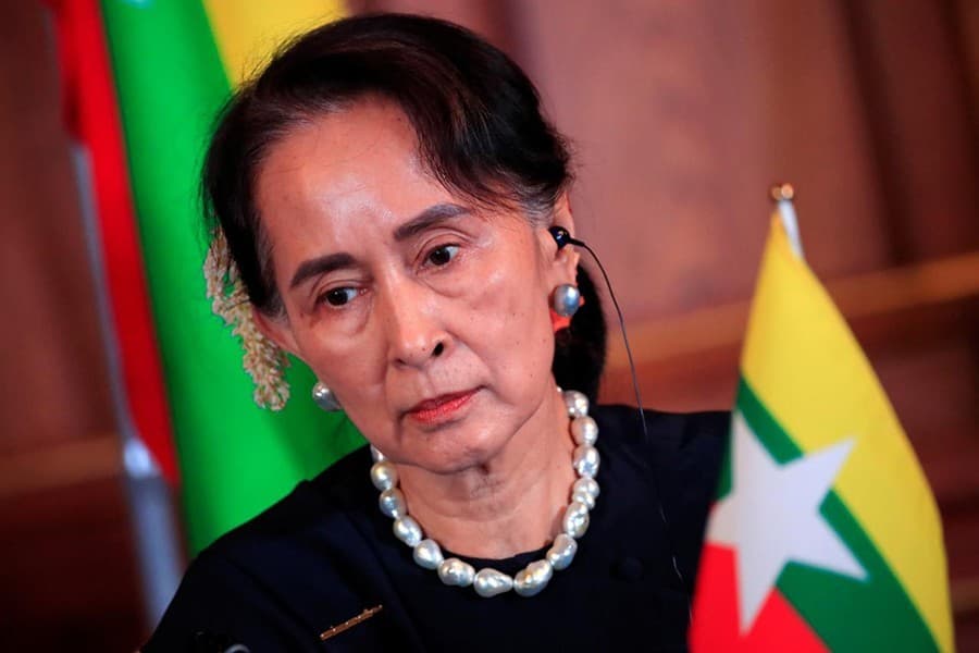 Suu Kyi departs for genocide hearings amid fanfare at home