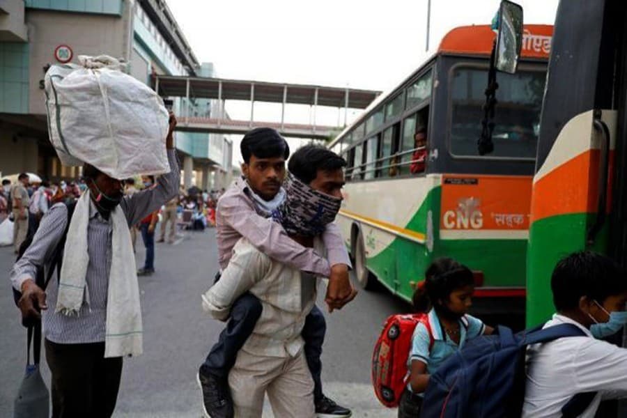 India to run trains, buses to allow migrant workers to leave cities