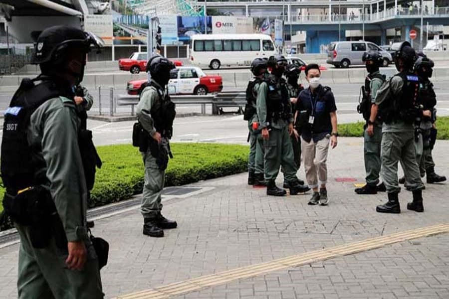Police shield Hong Kong legislature as protesters gather against anthem bill