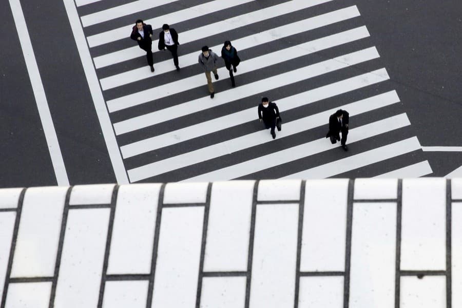 Japan's economy shrinks at record pace as pandemic wipes out 'Abenomics' gains