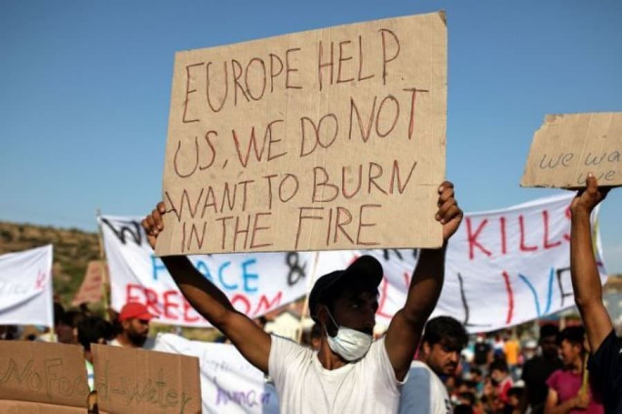 Police fire teargas as migrants demand to leave Greek island after fire