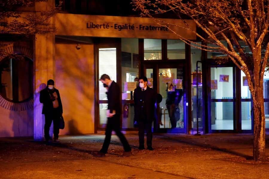 French police arrest nine after teacher beheaded in Paris suburb