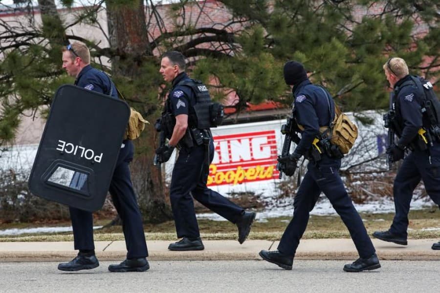 Police officer among 10 dead in US supermarket shooting