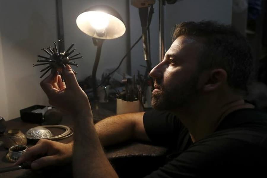 'Pain into beauty': Argentine sculptor turns pandemic waste into art