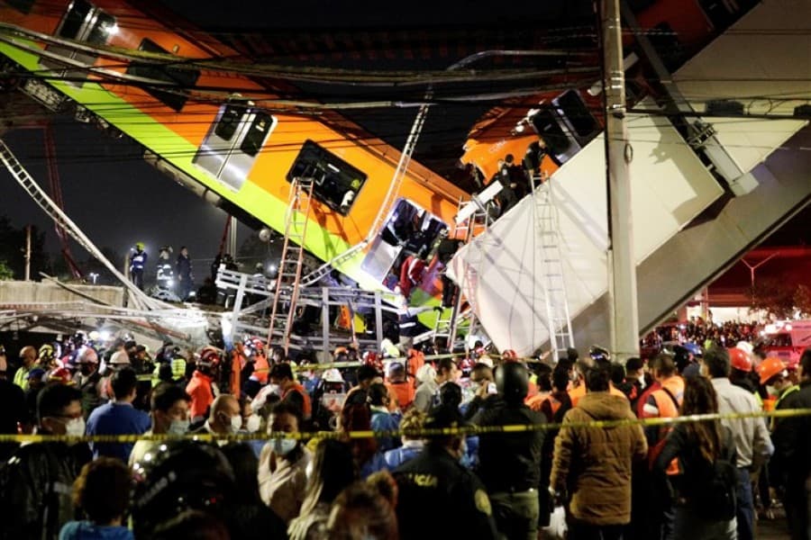At least 20 dead as Mexico City rail overpass collapses onto road