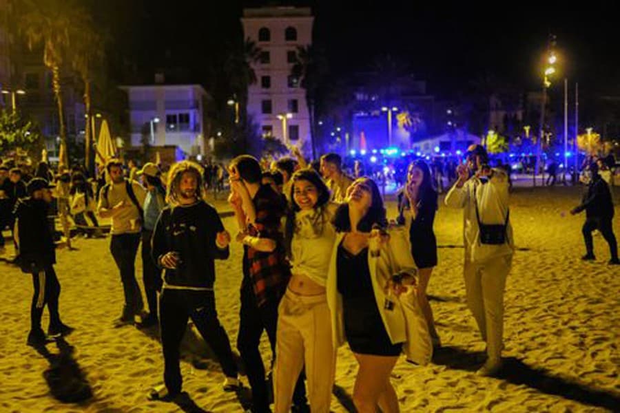 Police move revellers off streets at Barcelona after lockdown easing