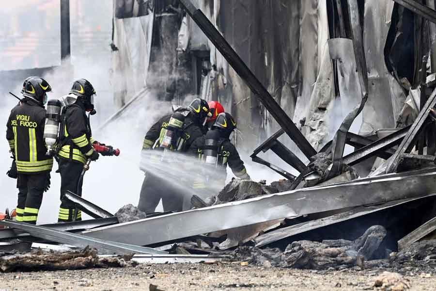 Small plane crashes into empty building outside Milan, all eight on board die