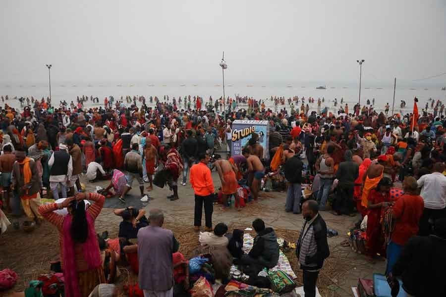Hundreds of thousands of Indians gather for holy dip, defying COVID-19 surge