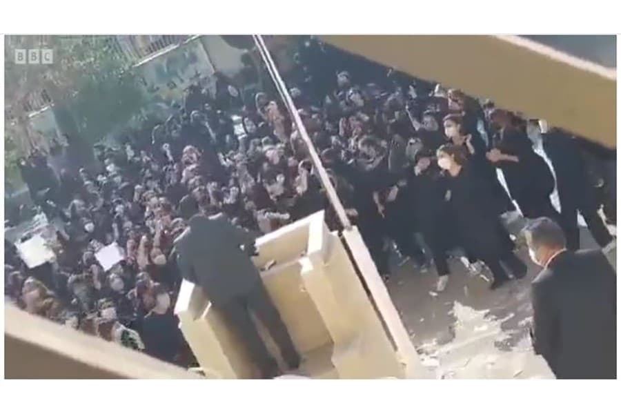 Schoolgirls heckle Iran paramilitary speaker