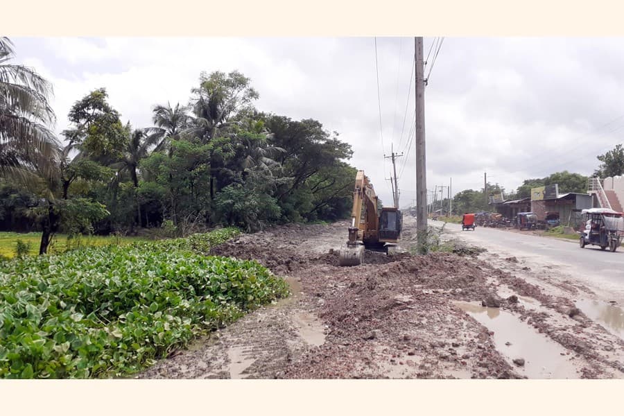 Four-lane highway construction destroying canal used for irrigation